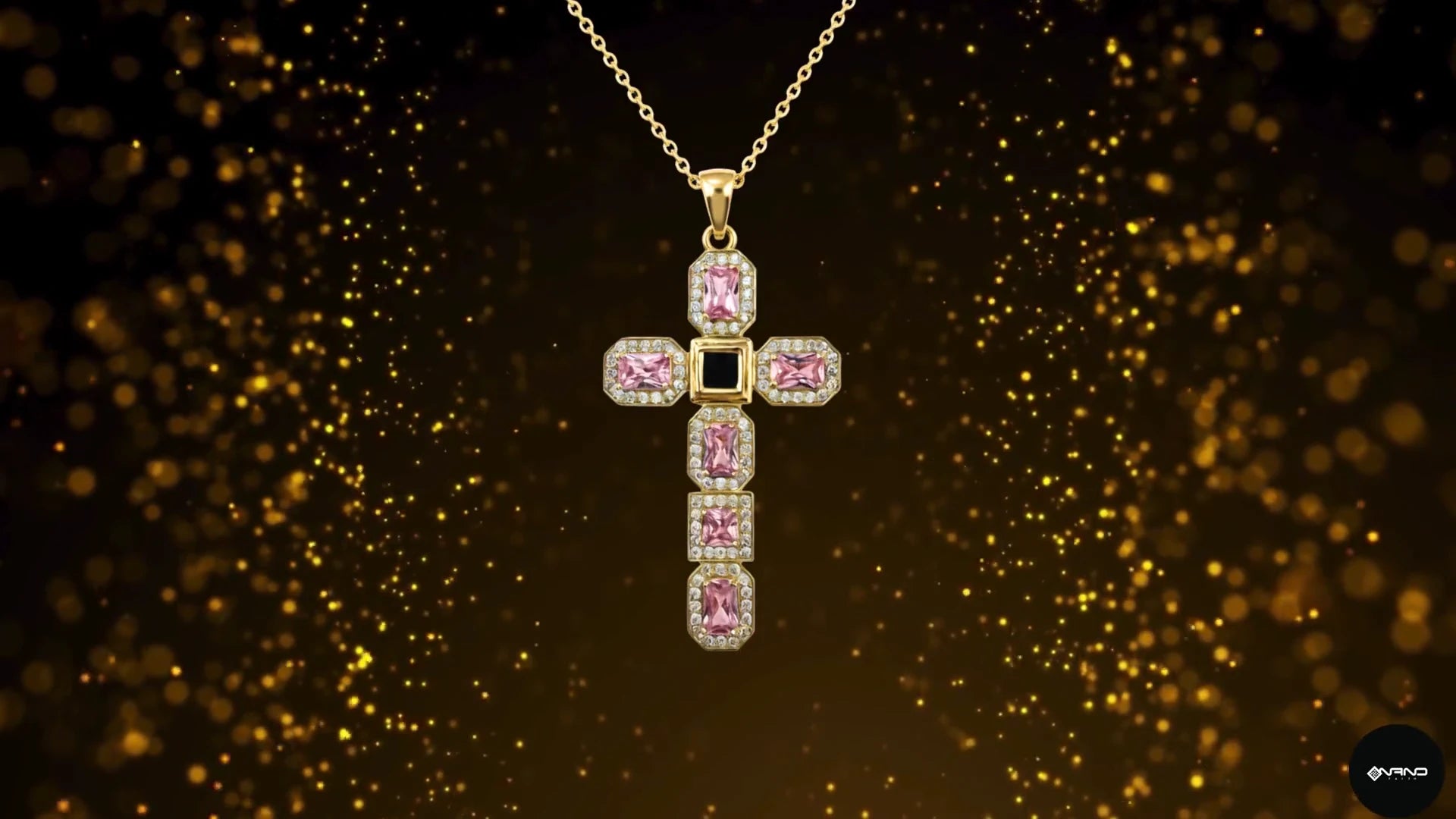 Pink cross pendant against a dark gold background; the supplied brand film also shows other Nano Faith designs