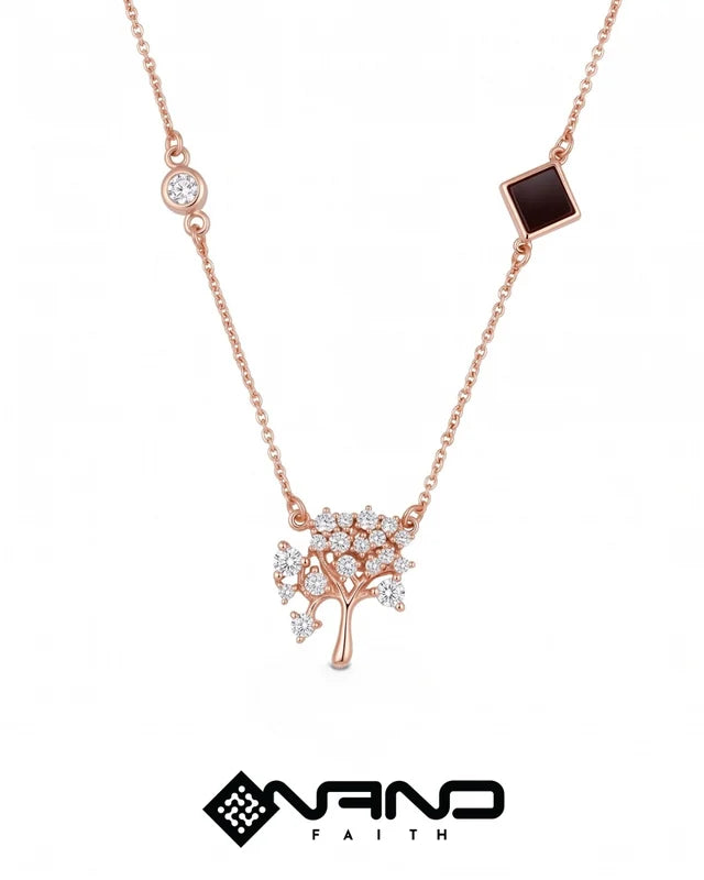 Rose gold necklace with delicate branching details and tiny dark insets