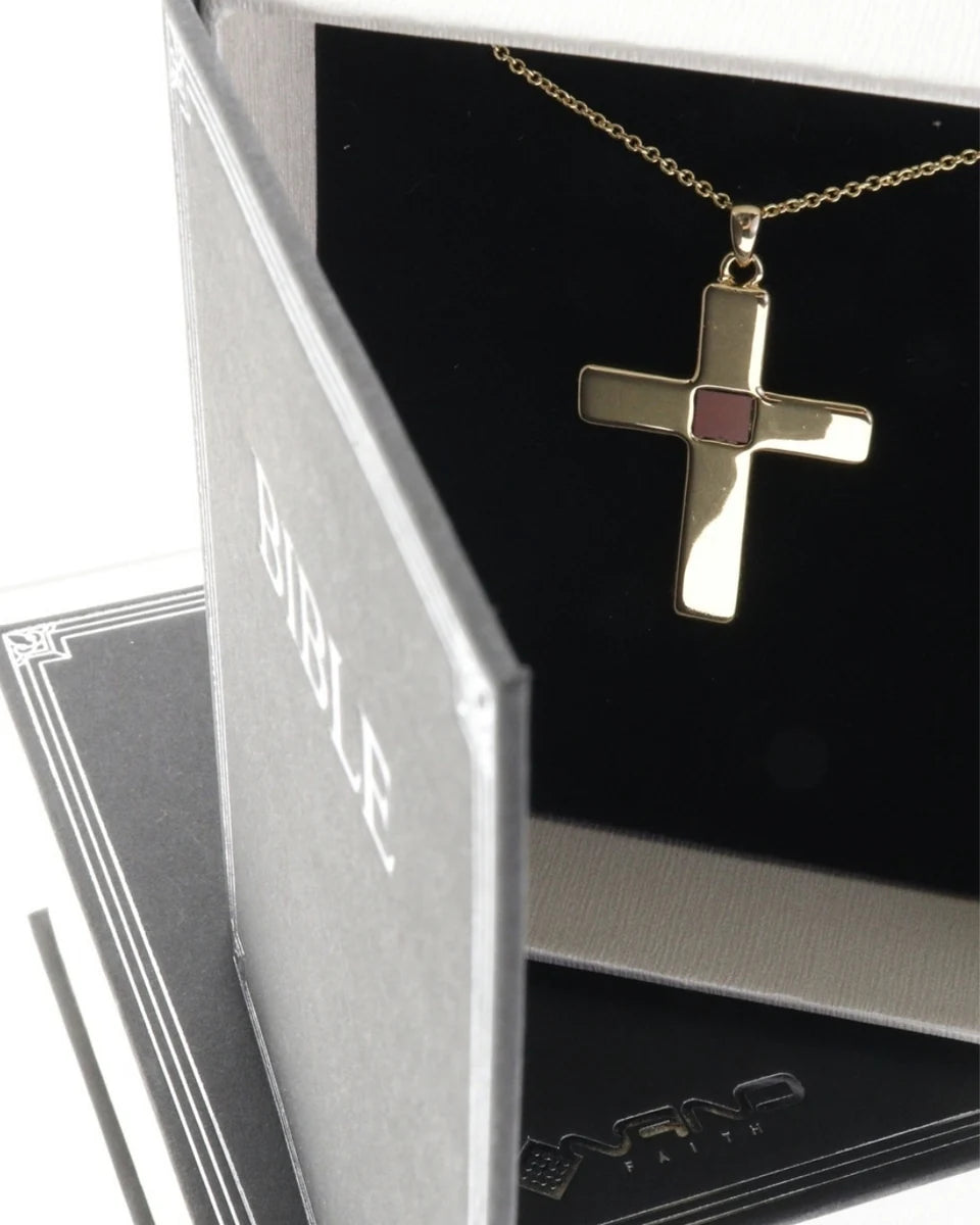 Gold cross necklace inside a textured Bible-shaped Nano Faith presentation box