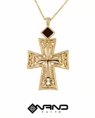 Decorative gold cross pendant with intricate openwork details